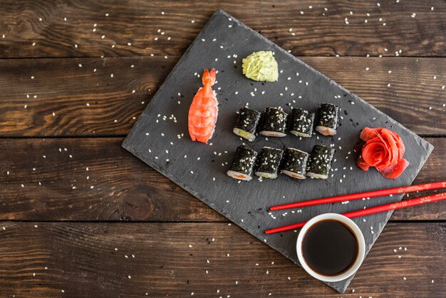 Fresh and tasty sushi on dark background.