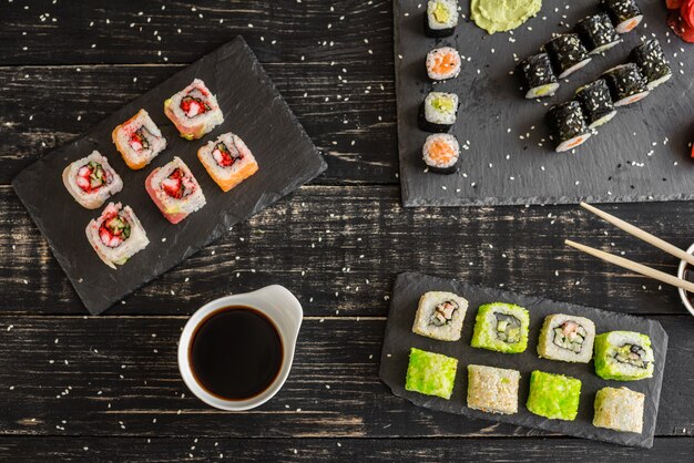 Fresh and tasty sushi on dark background. 