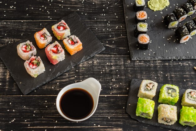 Fresh and tasty sushi on dark background. 