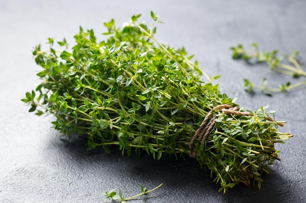 Fresh thyme bunch on slate background Close up