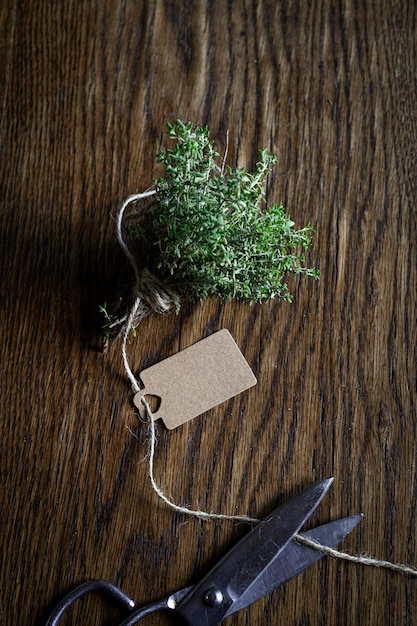 Fresh thyme sprig on a wooden table