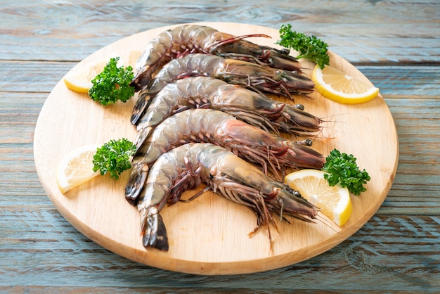 fresh tiger prawn or shrimp on wood board