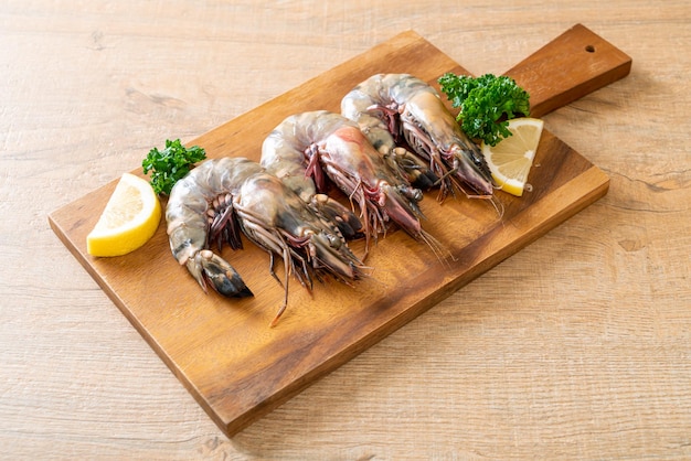 fresh tiger prawn or shrimp on wood board