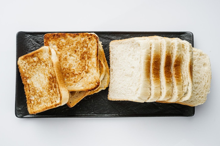 Photo fresh toasted bread on a white background
