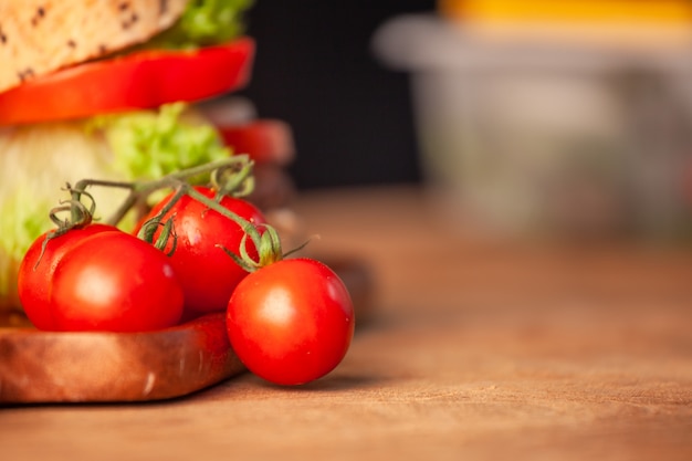 Fresh tomato with homemade hamburger in the kitchen