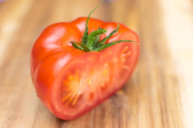 Fresh tomato on a wooden background