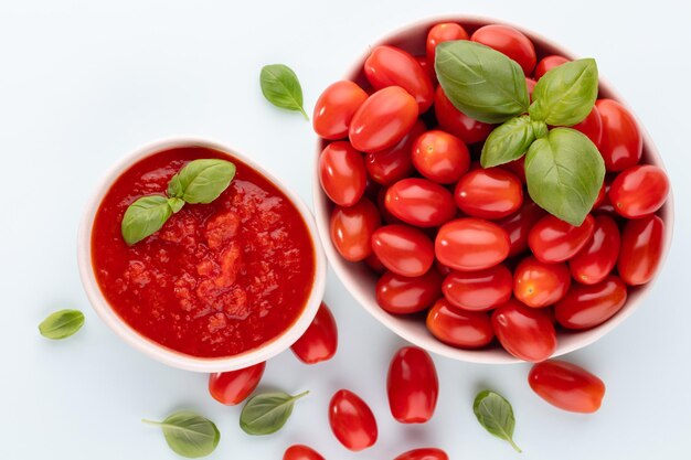 Fresh tomatoes in bowl on pastel table