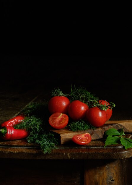 Fresh tomatoes and dill on the table