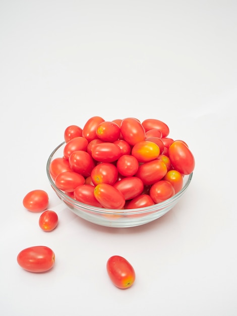 Fresh tomatoes in a glass bowl