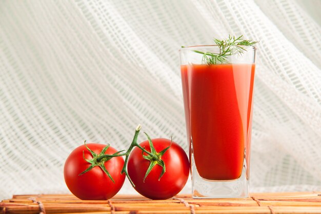 Fresh tomatoes juice set with dill