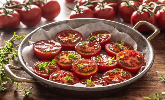 Fresh tomatoes in pan ready to dry or roasted.