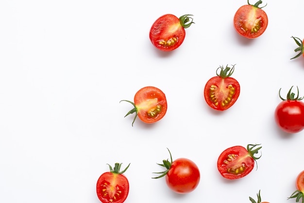 Fresh tomatoes, whole and half cut isolated.