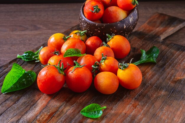 Fresh tomatoes on wooden background