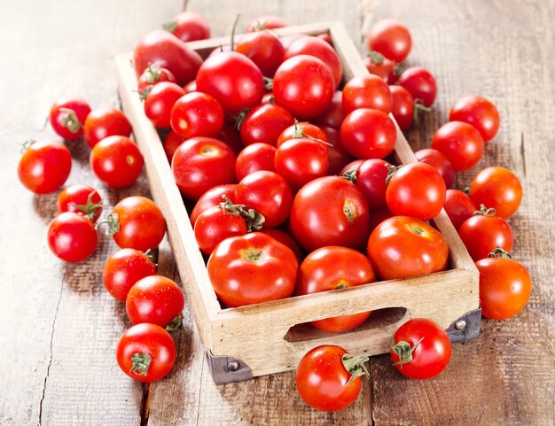 Fresh tomatoes in a wooden box