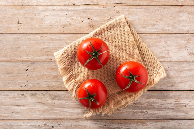 Fresh tomatoes on wooden table