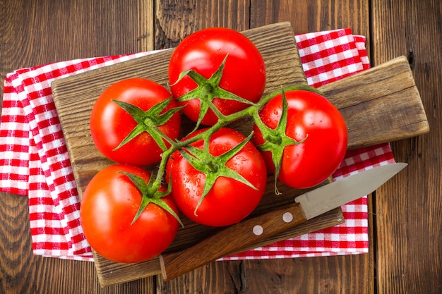 Fresh tomatoes on a wooden table