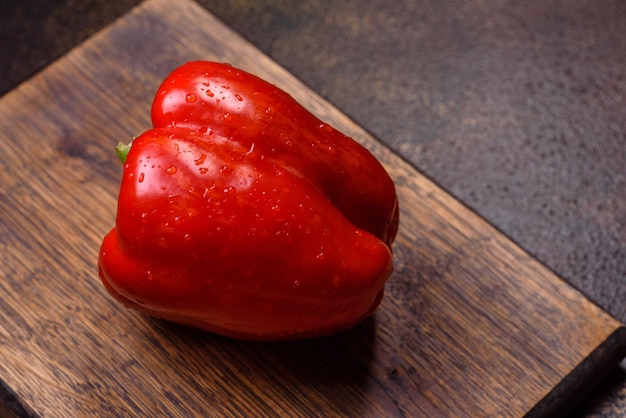 Fresh torn red sweet pepper from the autumn harvest