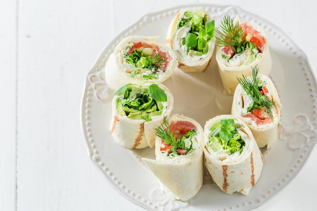 Fresh tortilla with vegetables cheese and herbs for a snack