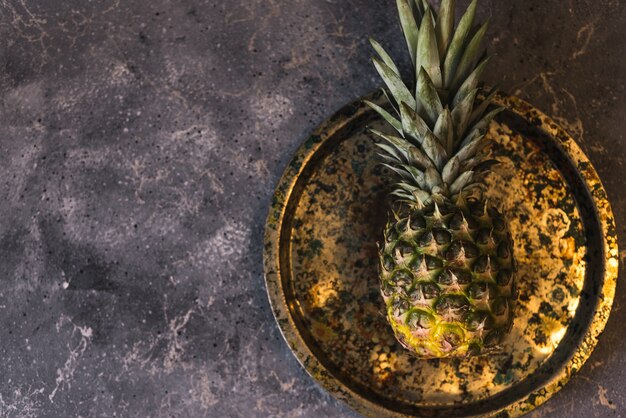 Fresh tropical fruit pineapple on a round plate