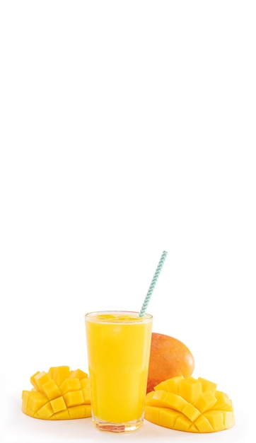 Fresh tropical mango juice with beautiful diced pulp and striped paper straw isolated on white background table close up cut out clipping path