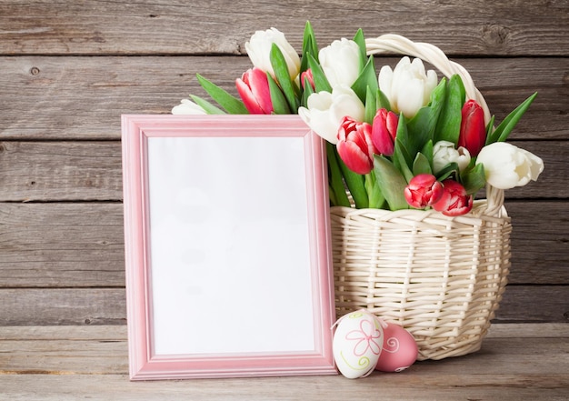 Fresh tulip flowers bouquet and photo frame