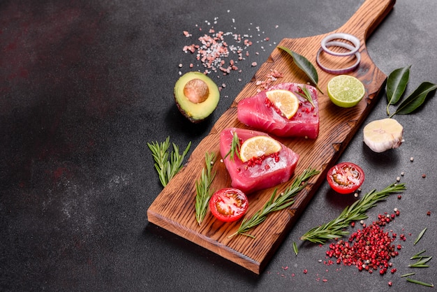 Fresh tuna fillet steaks with spices and herbs 