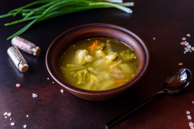 Fresh vegan soup with broccoli, cauliflower, asparagus and carrots. Useful healthy vegan food