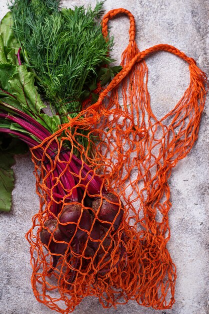 Fresh vegetable in fishnet bag