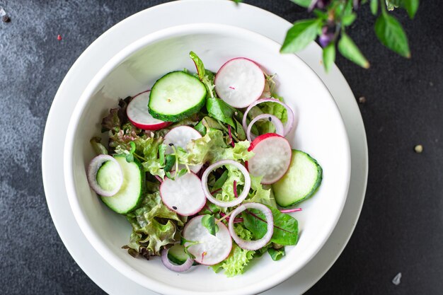 Fresh vegetable green salad radish cucumber mix leaves