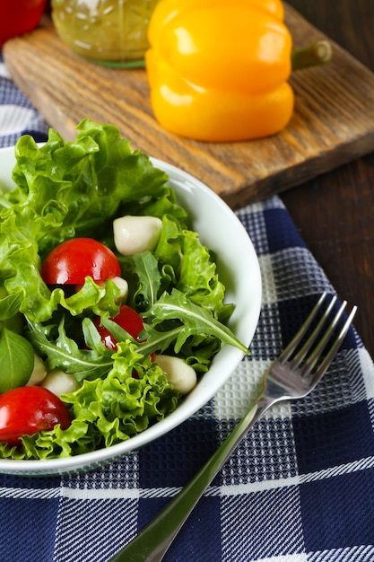 Fresh vegetable salad in bowl on table close up