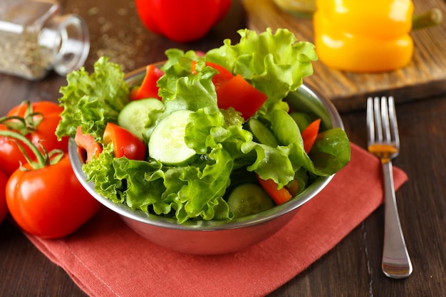 Fresh vegetable salad in bowl on table close up