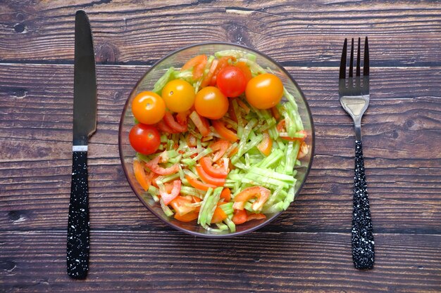 Fresh vegetable salad bowl on table