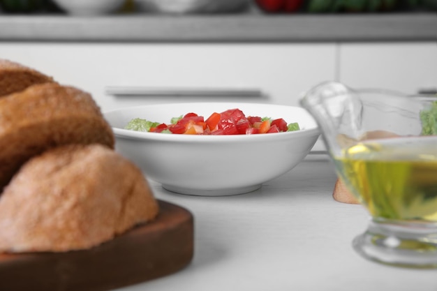 Fresh vegetable salad and bread on a table