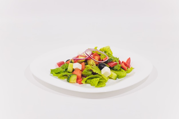 Fresh vegetable salad isolated on white background.