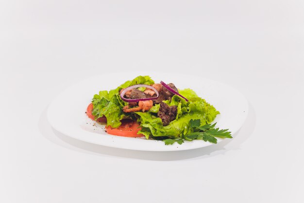 Fresh vegetable salad isolated on white background.