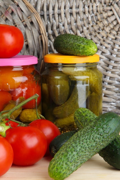 Fresh vegetables and canned on table close up