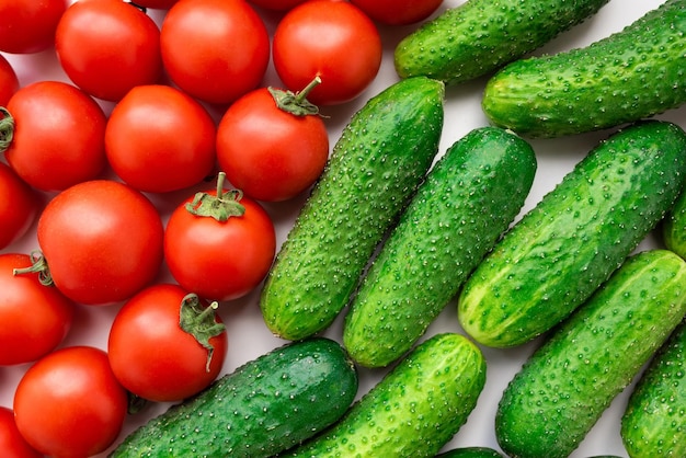 Fresh vegetables cucumbers and tomatoes on the table top view