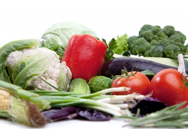 Fresh vegetables fruit on white