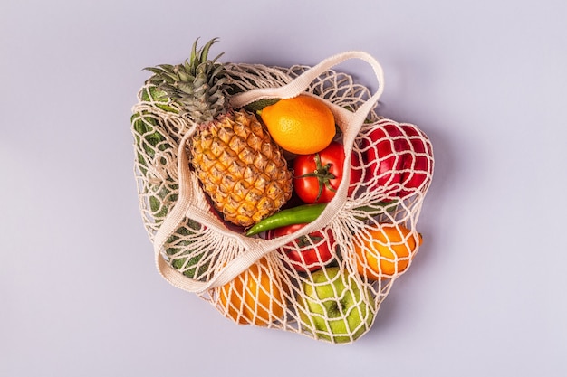 Fresh vegetables and fruits in bag mesh