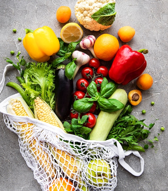 Fresh vegetables and fruits in the eco string bag