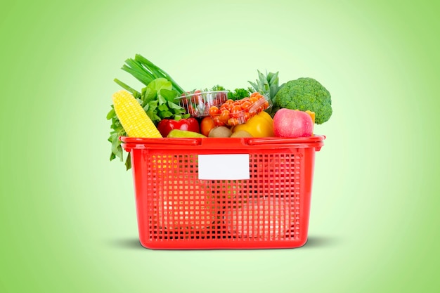 fresh vegetables and fruits in a plastic basket