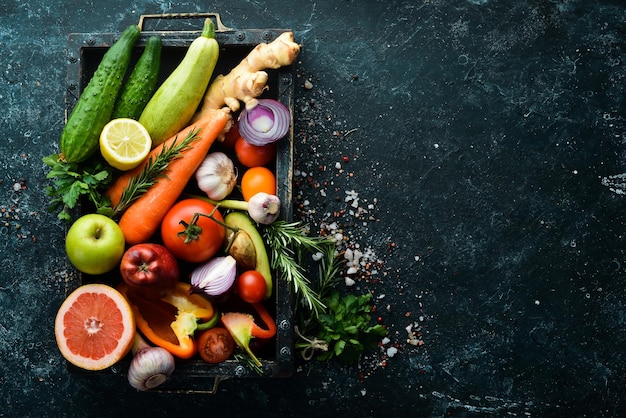 Fresh vegetables and fruits in wooden box Organic food