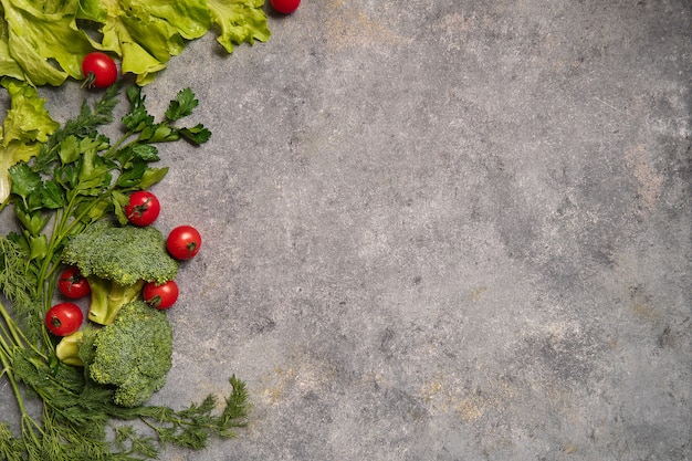 Fresh vegetables on gray background.