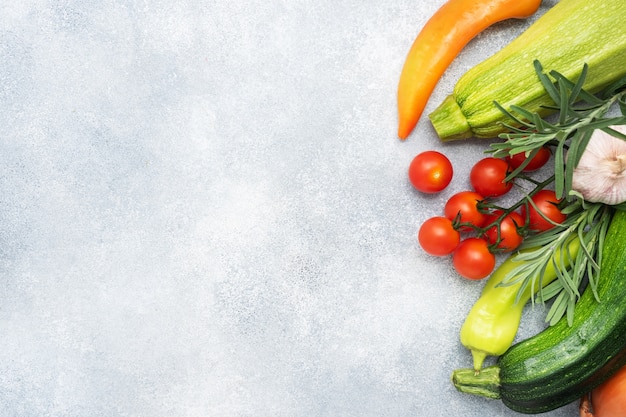 Fresh vegetables on a gray background