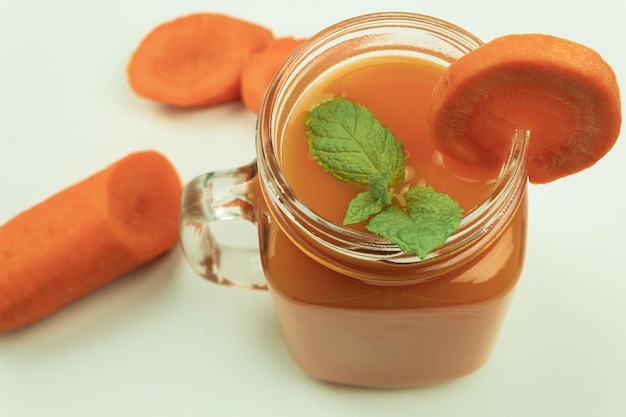 Fresh vegetables and juice on a white background