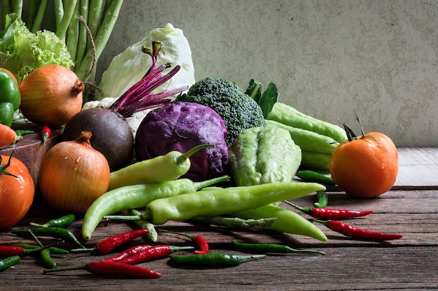 Fresh vegetables on old wooden table.