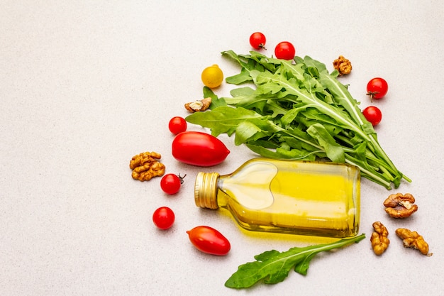 Fresh vegetables and olive oil bottle