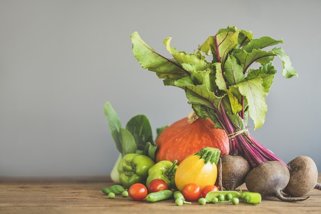 Fresh vegetables placed on wooden table