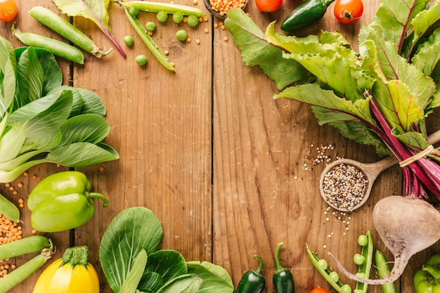 Fresh vegetables placed on wooden table