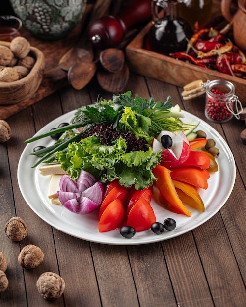 Fresh vegetables platter with greens